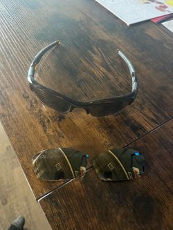 Pair of Oakley glasses with lenses and case