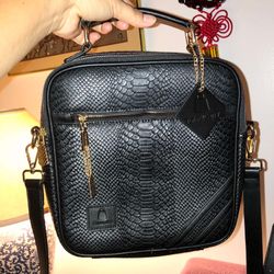 Tote & Carry Apollo 1 Mini Messenger Bag in black faux-snakeskin