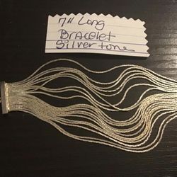 7” long Bracelet Silvertone. multiple strands.