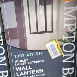 Hurley 19.25 in. Matte Black Farmhouse Outdoor 1-Light Wall Sconce with Clear Glass Shade