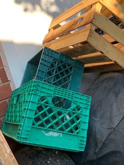 Green Plastic and wooden milk crates