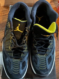 Air Jordan 11 Black and Yellow Sneakers