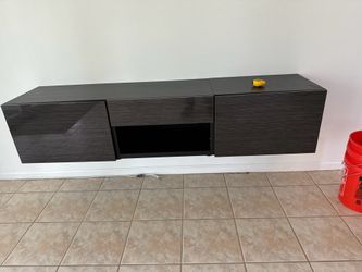 Floating tv or media stand great condition 71 long 16 deep 16 high 1drawer and 2 storage cabinets hardware to hang  asking 75 need gone asap