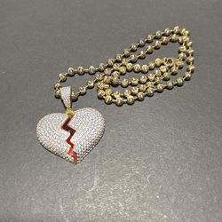 Broken heart pendant with moon cut chain
