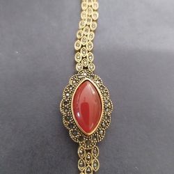 A Golden Bracelet With Agate Stone
