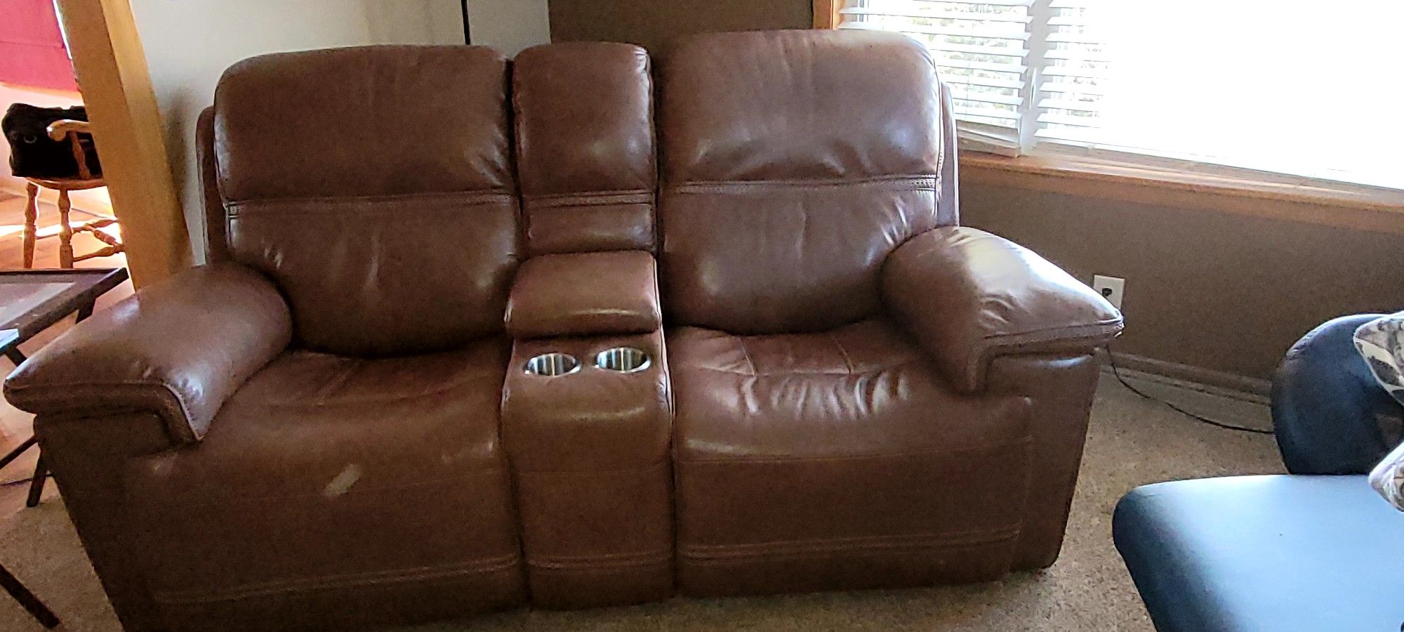 Like new Leather Reclining Love Seats