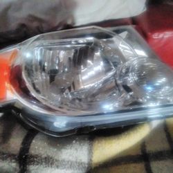 A Right Headlight Assembly Brand New
