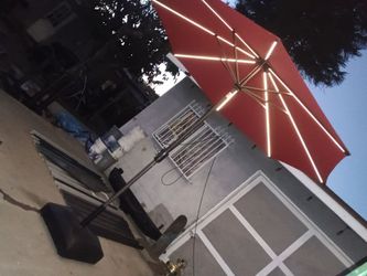 Solar powered tilt crank 9' patio umbrella with led strips & stand