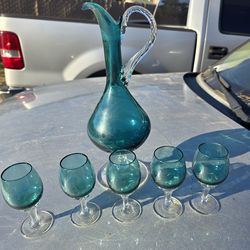 Glass pitcher with cups