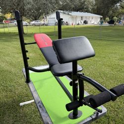Weider Weight Bench With Uprights For Bench Presses, Preacher Curl, And Leg Extension Attachments 