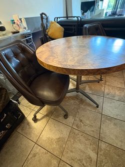 Dining room table and 2 leather chairs