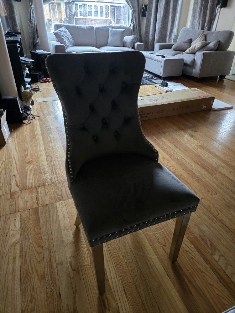 2 Dark Grey Suede dining room chairs.