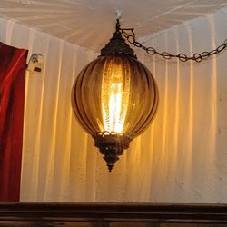 Vintage 1970s pendant light. Makes cool designs on ceiling & wall. Glass & metal