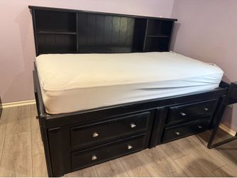 Twin bed with shelves