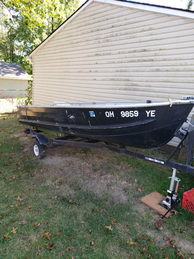14 ft v boat & Trailer also new 55 thurst Motorola motor, text mo {contact info removed}