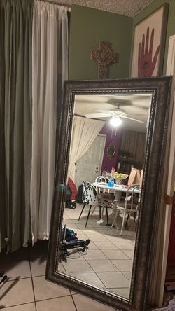 Large full-length floor mirror featuring a wide, textured dark silver and bronze toned ornamental frame