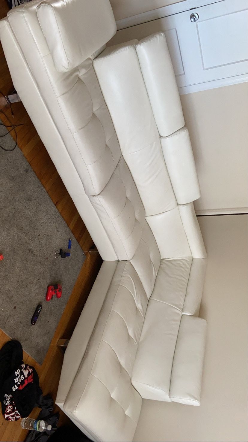 White leather sectional with cocktail table