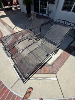 2 wrought iron pool chaise chairs