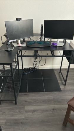 Black L-Shaped desk with a holder