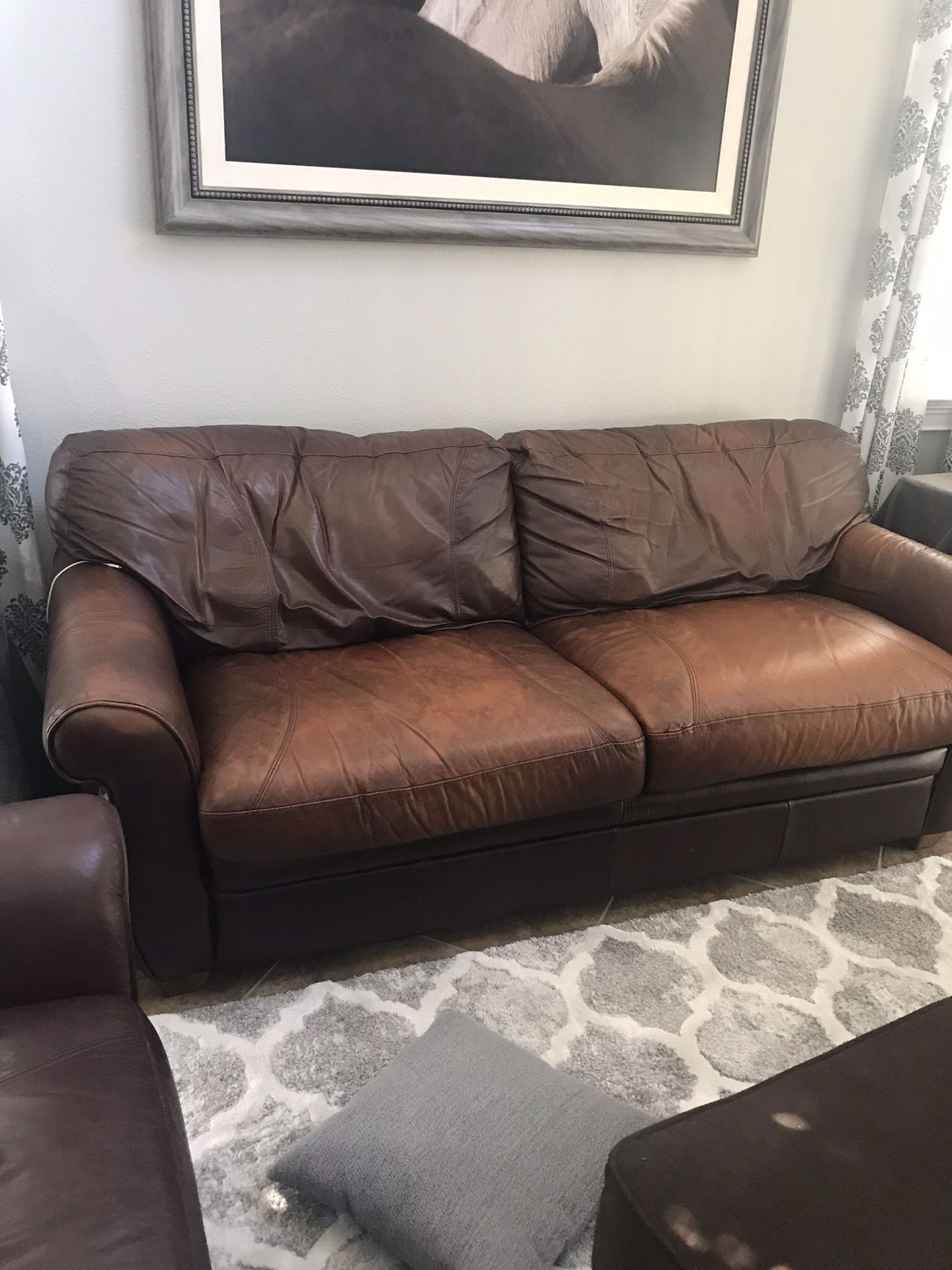 Living room set ......Leather sleeper sofa, love seat , chair and ottoman