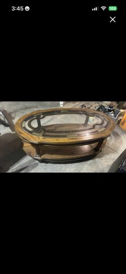 Very nice wood and glass two tier coffee table 45”L 16.6”T 25”W