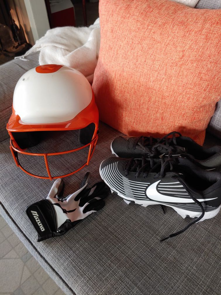 Softball helmet, cleats, and right handed glove