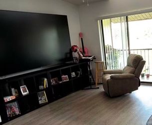 98” ONN tv with two storage cubed tables