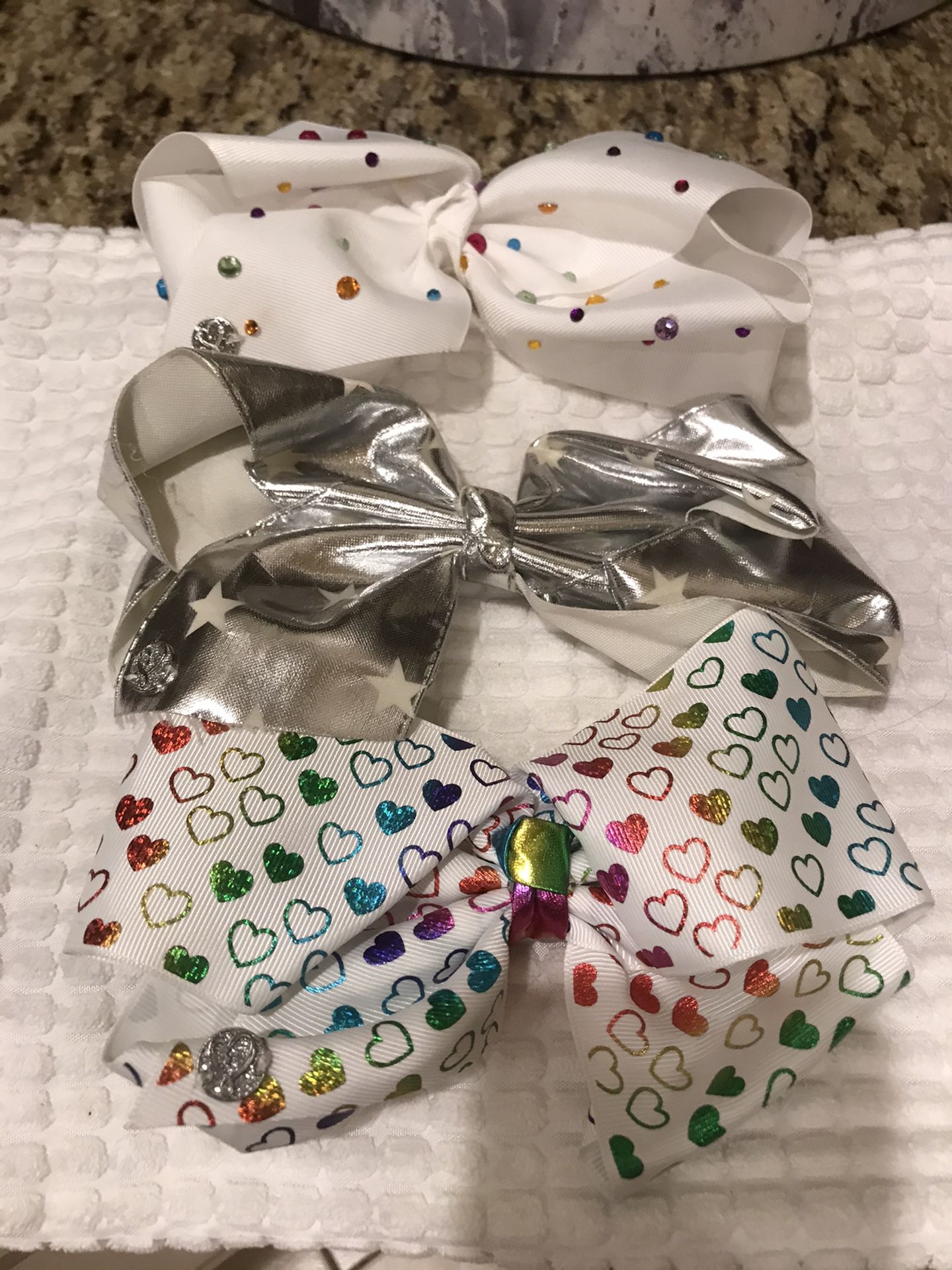 3 3 Large signature Jojo Siwa bows. Original price $15 each .