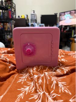 Small pink safe/piggy bank