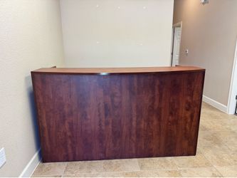 Sturdy Brown Reception Desk – Great for Office or Front Desk Use.