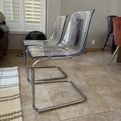 Two Clear Acrylic Ikea Chairs