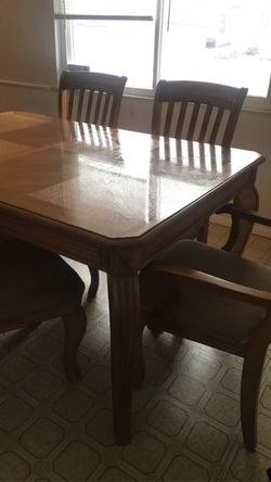 wooden table with 6 chairs