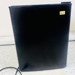 Compact black refrigerator Avanti.