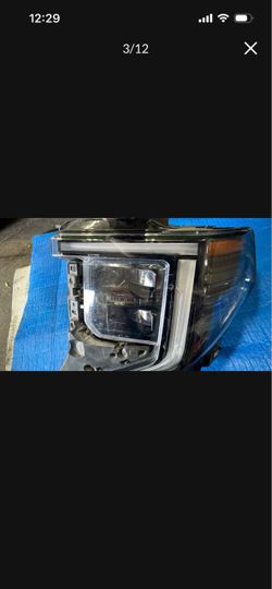 22 GMC Sierra left  Headlight OEM