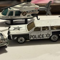 Vintage police vehicles, toy collector cars
