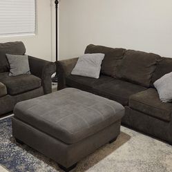 Gray sofa and loveseat with ottoman