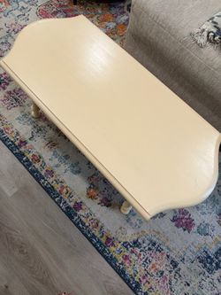Cream colored wood coffee table