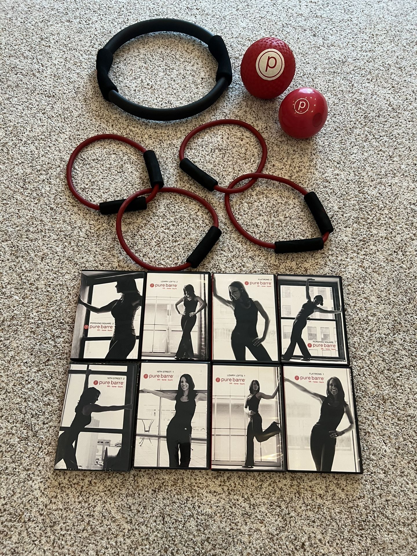 Pure Bar Eight Piece DVD set with a pound sand ball, fitness