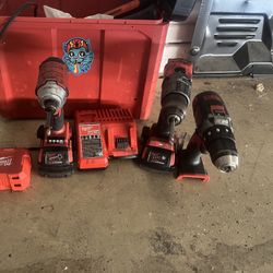 Milwaukee Impact And Two Drills  Two Batteries,  And A Charger