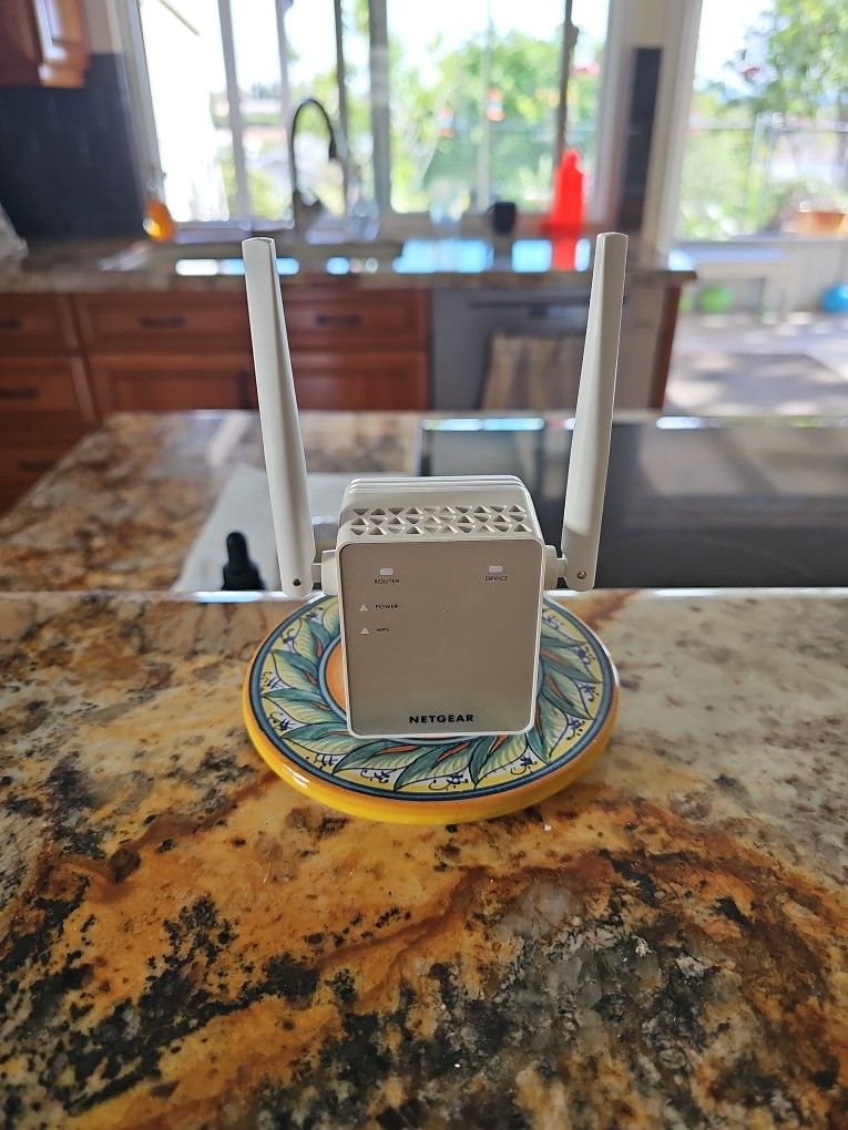 Netgear Ex6120 AC1200 WiFi Range extender dual band wall plug booster.