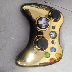 This is a Microsoft Xbox 360 Special Edition Chrome Series wireless controller in a gold finish. 