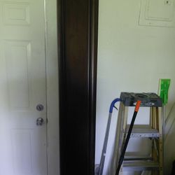 It's mahogany wood Cal l king bed frame Pristine condition