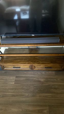 Dark wood and metal TV stand Dark wood and metal TV stand