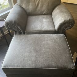 Grey faux leather chair w ottoman 