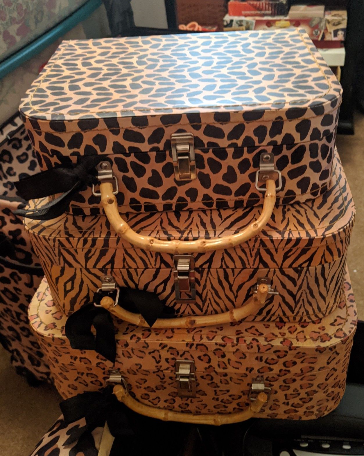 Stackable animal print mini suitcases for storage