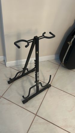 show a Quik Lok Short A-Frame Acoustic Guitar Stand, featuring a black steel frame and rubberized cradles