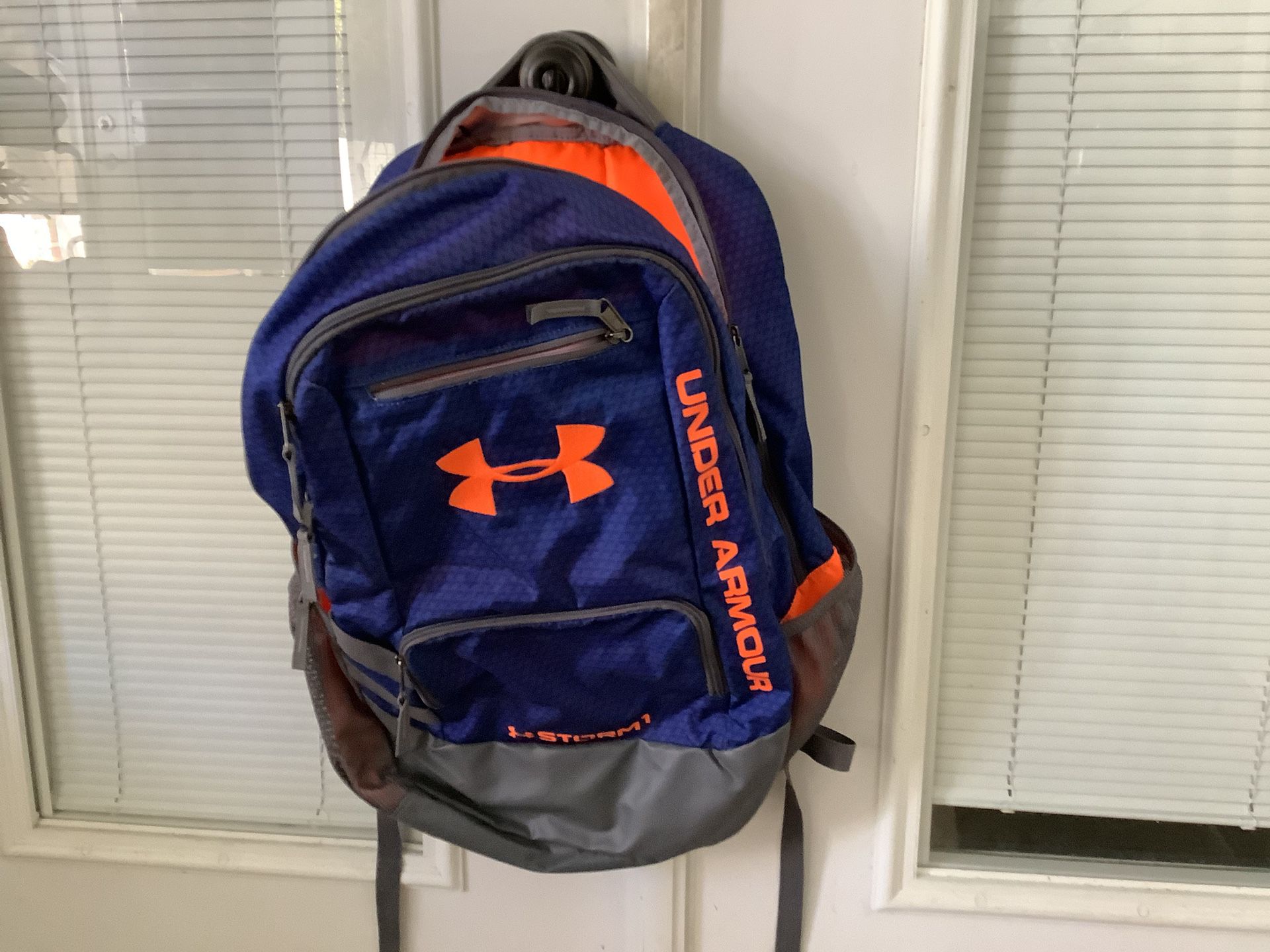 Under Armour Storm backpack blue with orange detail