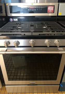 New Maytag stainless steel 5 burner stove and microwave and dishwasher