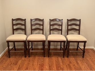 4 Solid Wood Bar Stools with Cream Colored Seats