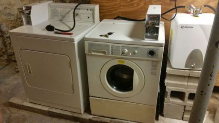 Coin op washer/dryer and water heater